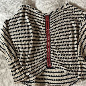 Knitted shirt with beaded detail